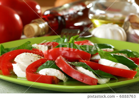 Salad caprese with fresh tomatoes, cheese and basil. Salad caprese with fresh tomatoes, cheese and basil. 6888763
