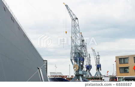 Covered dock and cranes in shipyard Covered dock and cranes in shipyard 6888887