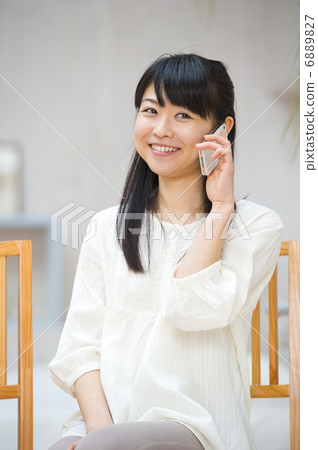 A woman enjoying smartphone A woman enjoying smartphone 6889827