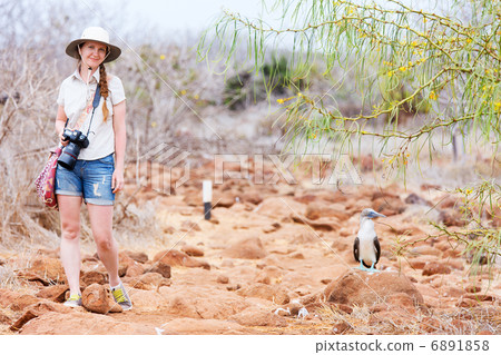 Female tourist at Galapagos islands 6891858