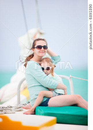 Family sailing on a luxury yacht Family sailing on a luxury yacht 6891890