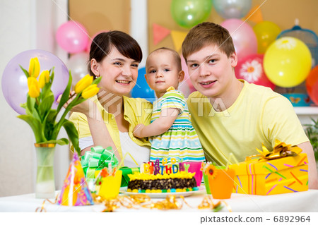 family celebrating first birthday of baby daughter family celebrating first birthday of baby daughter 6892964