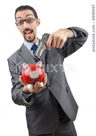 Businessman killing the piggy bank Businessman killing the piggy bank 6896097