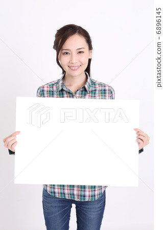 A woman with a white board A woman with a white board 6896145