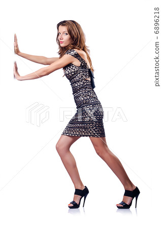 Young attractive woman pushing virtual obstacles 6896218