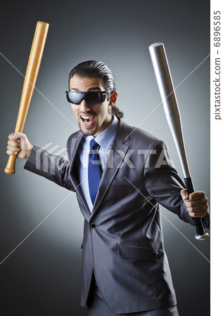 Angry businessman with bat on white 6896585