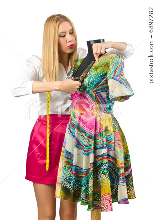Woman tailor working on dress 6897282