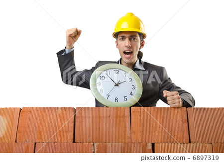 Businessman with bricks on white 6897319