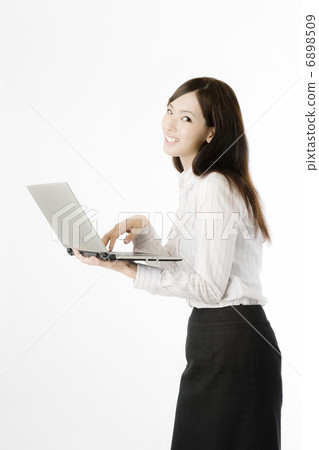 A woman with a laptop 6898509