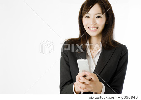 Smartphone and female employees Smartphone and female employees 6898943