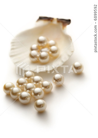 Scattering white pearls in seashell Scattering white pearls in seashell 6899592