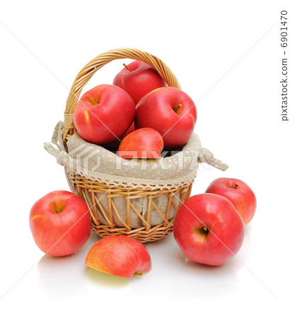 red apples in a basket on a white background red apples in a basket on a white background 6901470