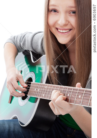 .Beautiful girl with guitar on white background .Beautiful girl with guitar on white background 6903697