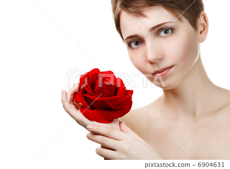 Portrait of young beautiful woman with red rose 6904631