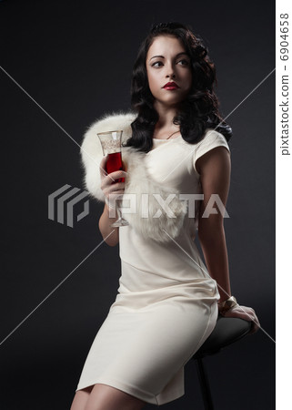 graceful woman holding glass of wine. retro portrait graceful woman holding glass of wine. retro portrait 6904658