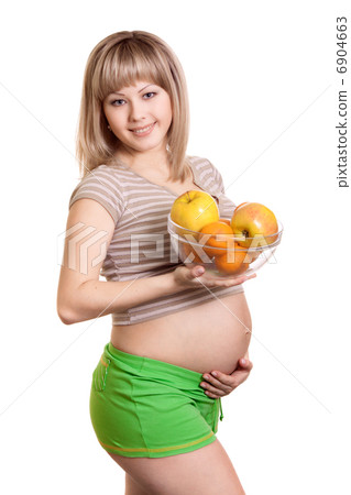 Portrait of pregnant woman with fruits in dish isolated on white Portrait of pregnant woman with fruits in dish isolated on white 6904663