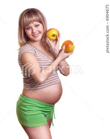 Portrait of pregnant woman with apple in hands isolated on white Portrait of pregnant woman with apple in hands isolated on white 6904675