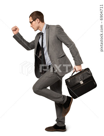 Man in a business suit with suitcase isolated 6904711
