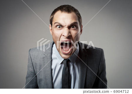Angry businessman shouting 6904712