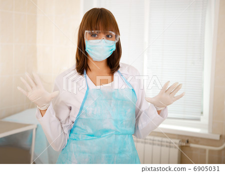 young nurse just after operation in surgery young nurse just after operation in surgery 6905031