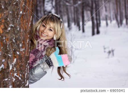 pretty young woman thumbs-up in winter forest pretty young woman thumbs-up in winter forest 6905041
