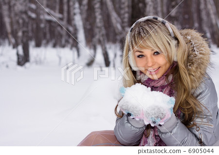 young pretty smiling woman in winter forest young pretty smiling woman in winter forest 6905044