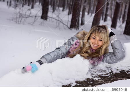 young pretty smiling woman in winter forest young pretty smiling woman in winter forest 6905046