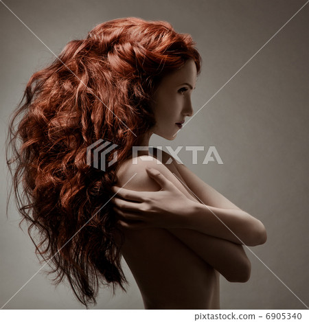 Beautiful woman with curly hairstyle against gray background Beautiful woman with curly hairstyle against gray background 6905340