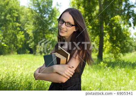 happy young student girl with books in park happy young student girl with books in park 6905341