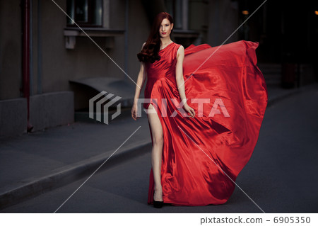Young Beauty Famous Woman In Fluttering Red Dress Outdoor Young Beauty Famous Woman In Fluttering Red Dress Outdoor 6905350