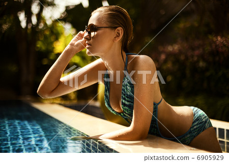 Portrait of young attractive woman having good time in swimming 6905929