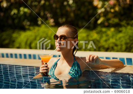 Portrait of young attractive woman having good time in swimming 6906018