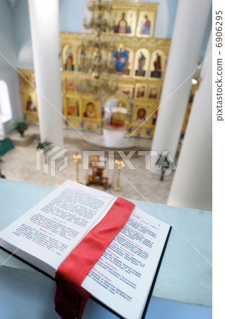 Orthodox Holy Bible on the table agains the sanctuary Orthodox Holy Bible on the table agains the sanctuary 6906295