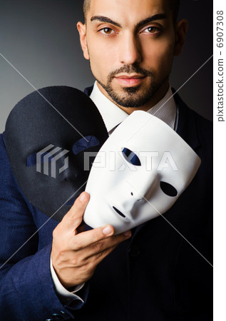 Man with black mask in studio Man with black mask in studio 6907308