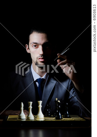 Chess player playing his game 6908613