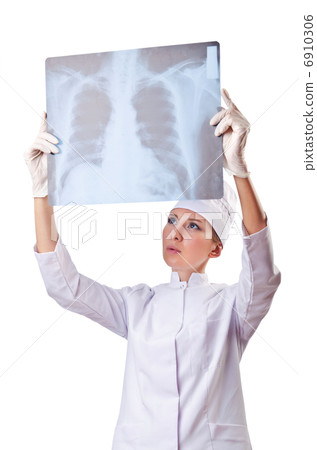 Woman doctor examining x-ray on white Woman doctor examining x-ray on white 6910306