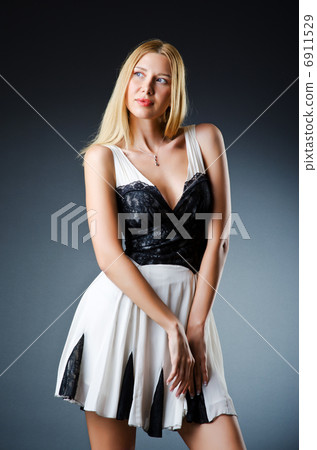 Beautiful woman in studio fashion shooting Beautiful woman in studio fashion shooting 6911529