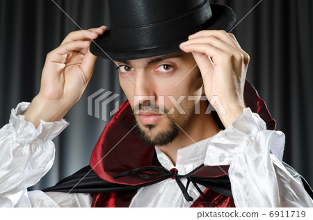 Magician doing tricks on white Magician doing tricks on white 6911719