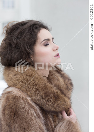 Love. Affectionate Dreamy Sensual Woman in Fur Coat in Reverie. Serene Love. Affectionate Dreamy Sensual Woman in Fur Coat in Reverie. Serene 6912361