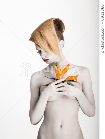 White Body Art. Daydreaming Naked Woman holding Fresh Flower. Exotic Hairstyle White Body Art. Daydreaming Naked Woman holding Fresh Flower. Exotic Hairstyle 6912366