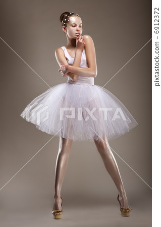 Sensuality. Elegant Styled Woman posing in White Dress. Fantasy Sensuality. Elegant Styled Woman posing in White Dress. Fantasy 6912372