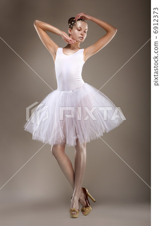 Ballet. Graceful Ballerina in White Light Tutu - Performance. Fantasy 6912373