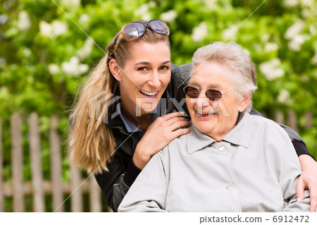Young woman is visiting her grandmother in nursing home Young woman is visiting her grandmother in nursing home 6912472