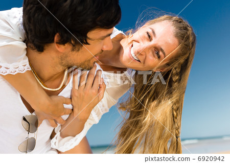 Couple enjoying freedom on the beach Couple enjoying freedom on the beach 6920942