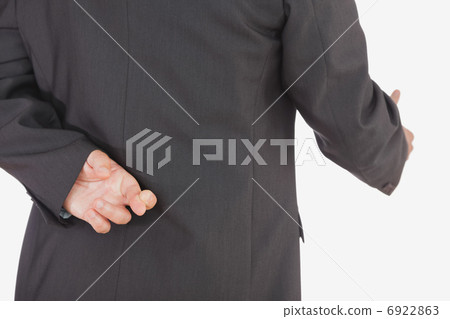 Businessman with crossed fingers offering handshake Businessman with crossed fingers offering handshake 6922863