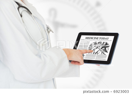 Doctor reading from digital tablet Doctor reading from digital tablet 6923003