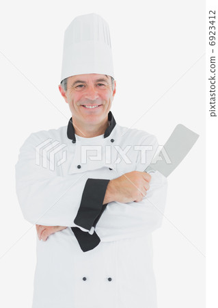 Happy chef holding meat cleaver 6923412