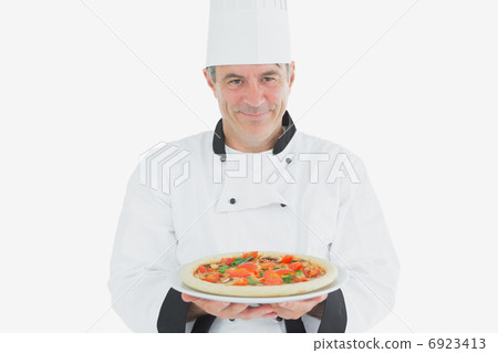 Male chef holding pizza 6923413