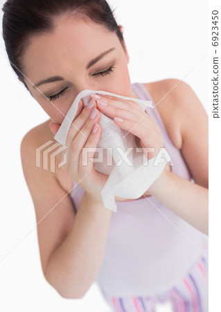 Woman blowing her nose Woman blowing her nose 6923450