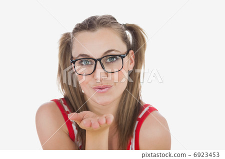 Young woman blowing air kiss Young woman blowing air kiss 6923453